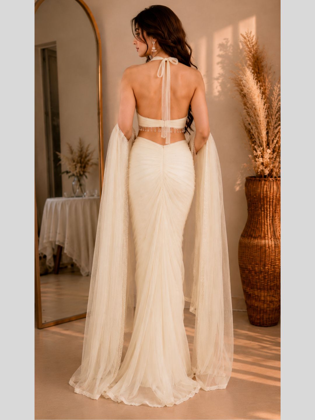 Adaa Bazaar Georgette Embellished Pre-Draped Skirt Set with Designer Halter Blouse and Dupatta.